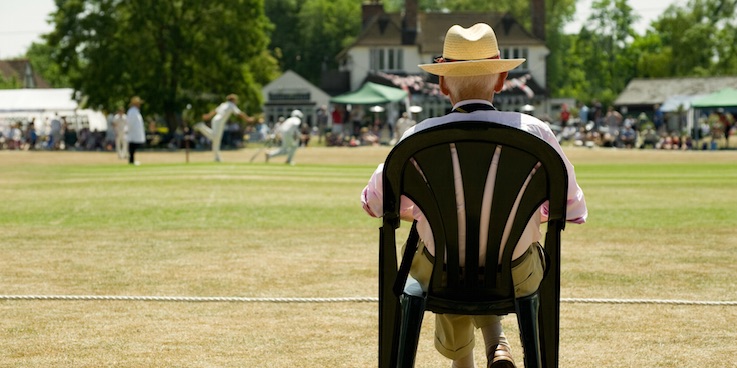 Old man watching cricket