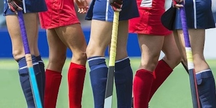 Girls playing hockey header