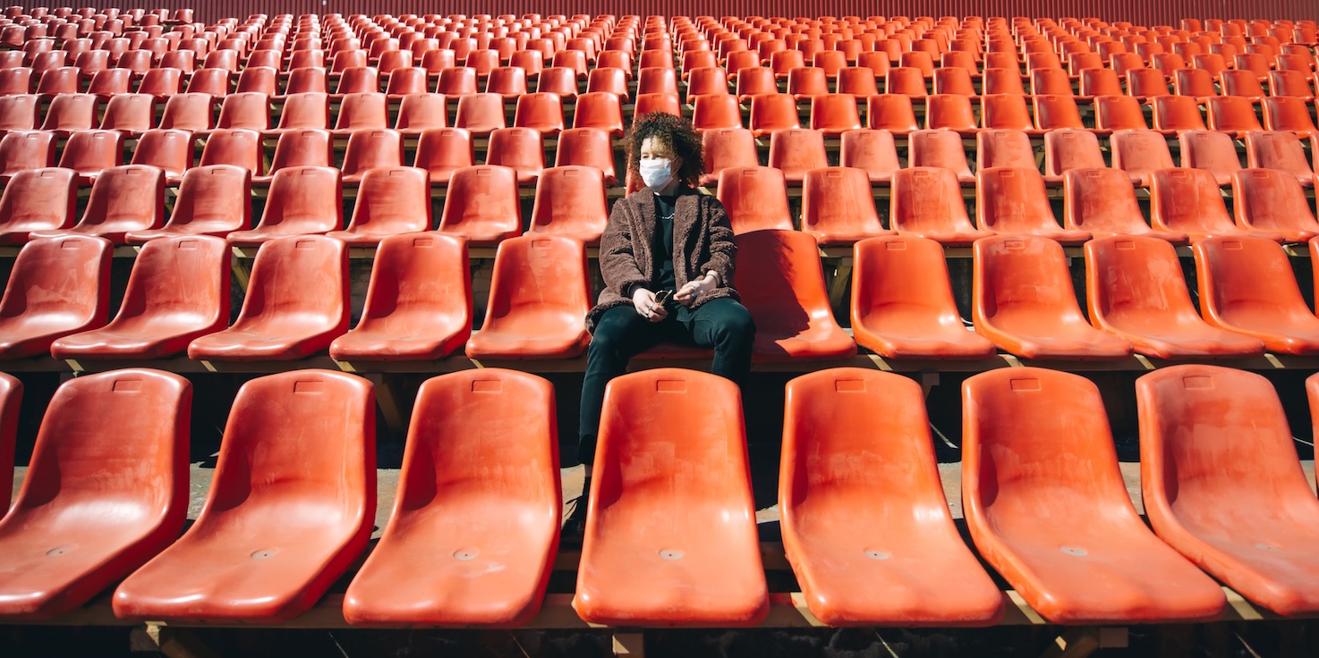 Women in empty stand