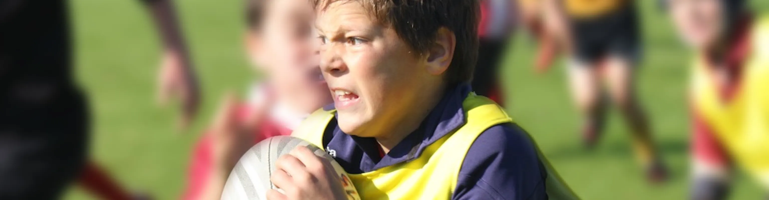 Boy playing rugby