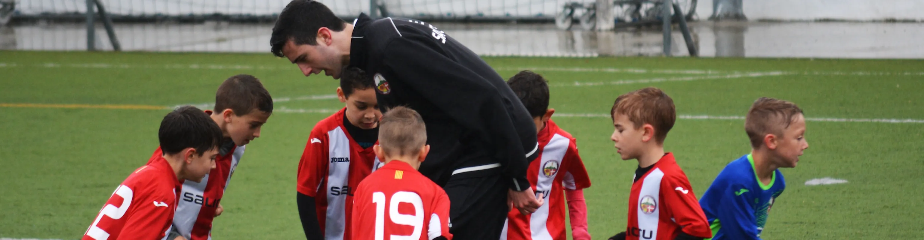 Kids being coached football