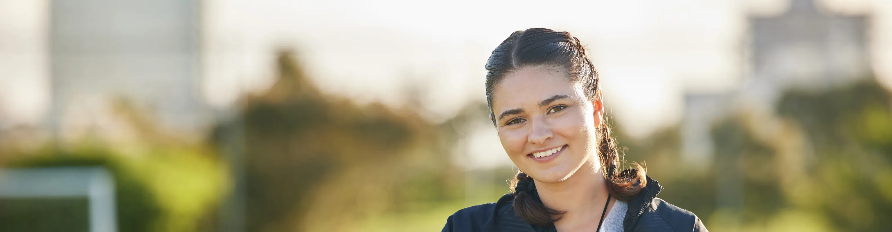 Women with clipboard smiling at the camera