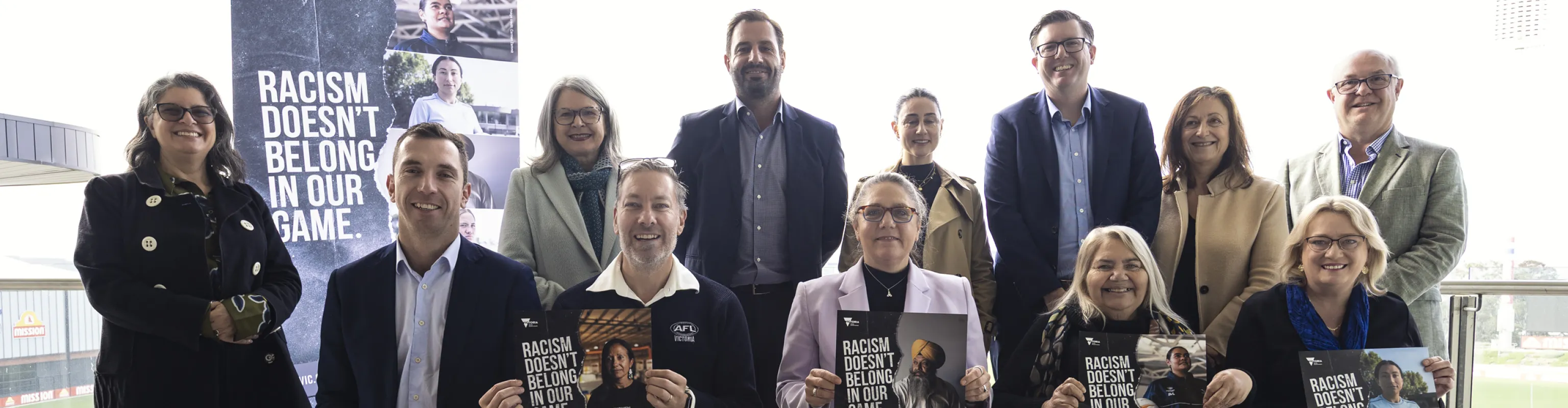 13 sport leaders pose for the launch of the Racism Doesn't Belong in Our Game campaign.