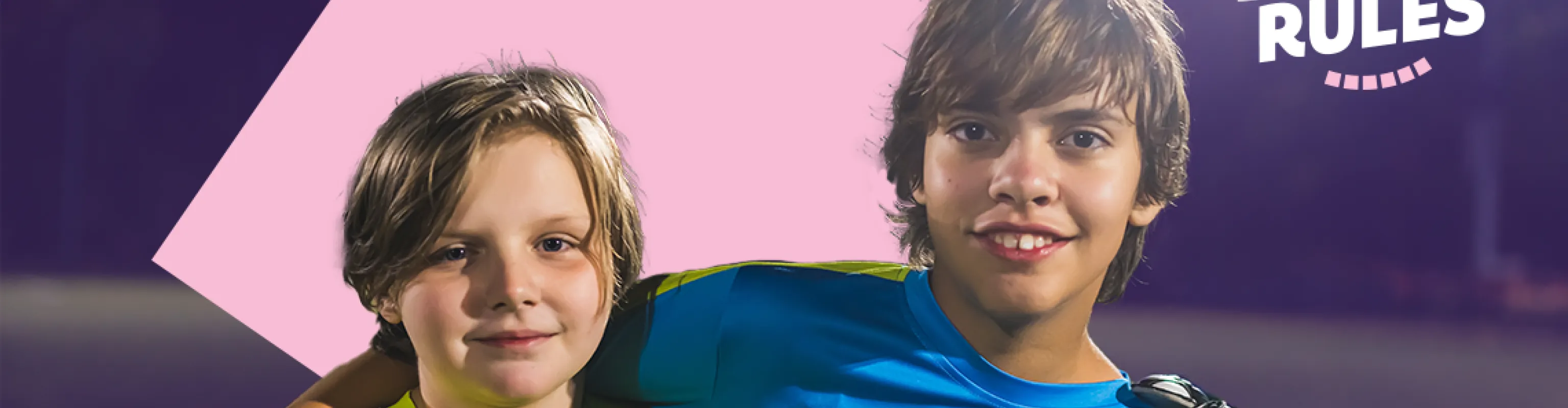Two young boys smile at the camera