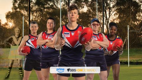 Five people in football clothing staring at the camarea