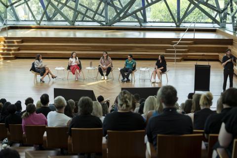 Five people engaged in a panel discussion at the DISA 2024 forum
