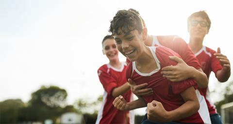 Young boys enjoy playing a team sport