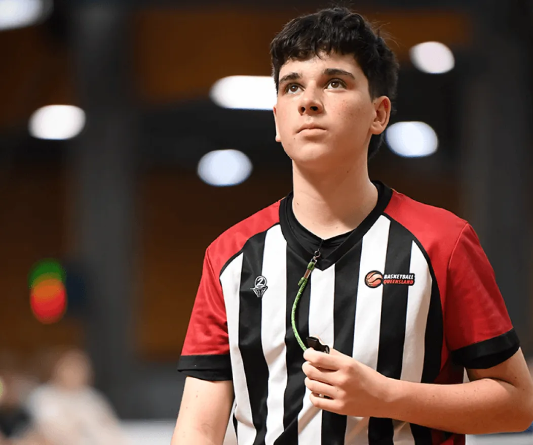 Referee in basketball court