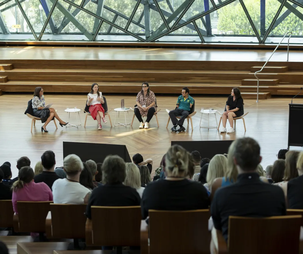 Five people engaged in a panel discussion at the DISA 2024 forum