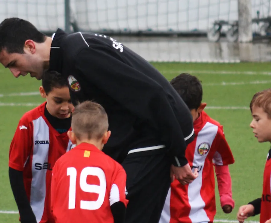 Kids being coached football