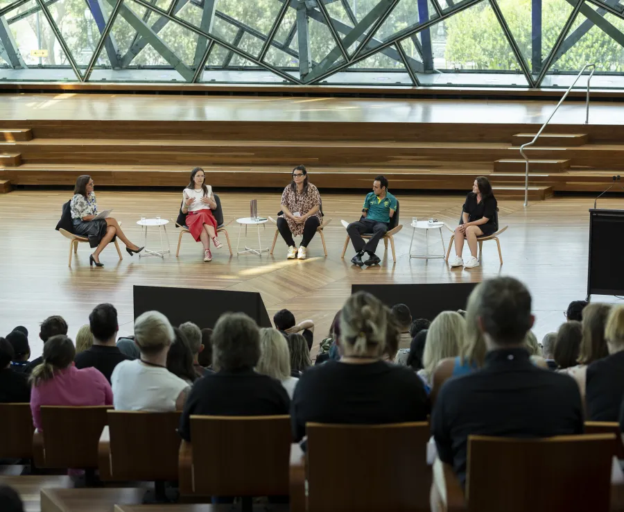 Five people engaged in a panel discussion at the DISA 2024 forum