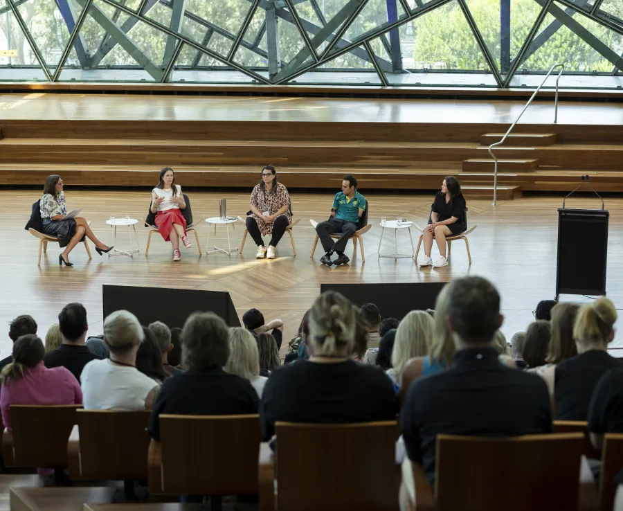 Five people engaged in a panel discussion at the DISA 2024 forum