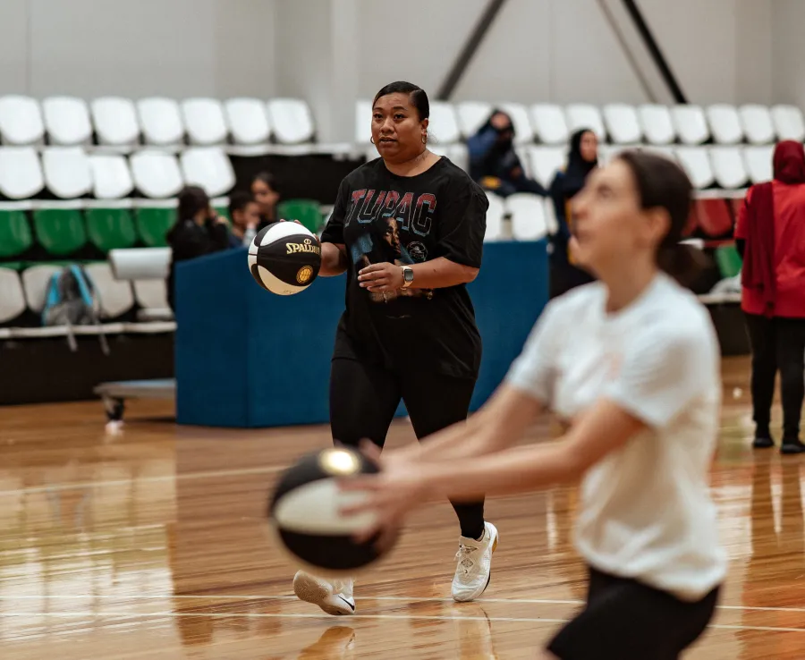 Two Phoenix players from the casual women's team practice on the court