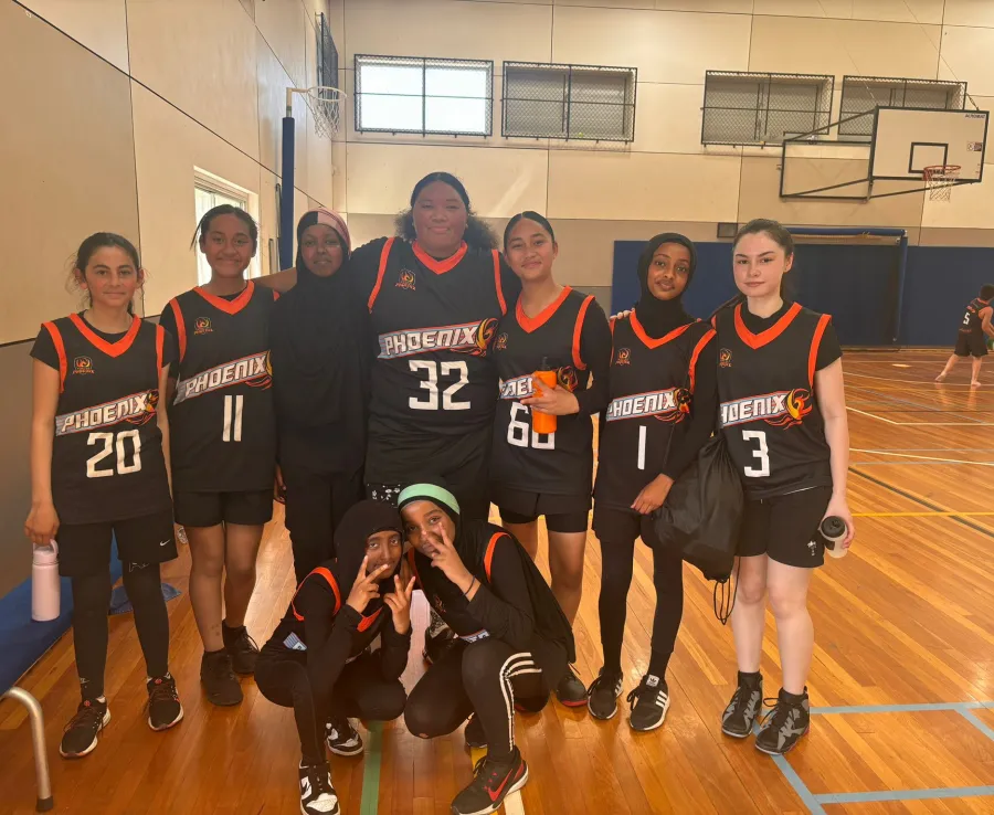 A Phoenix U16 girls team poses on the court