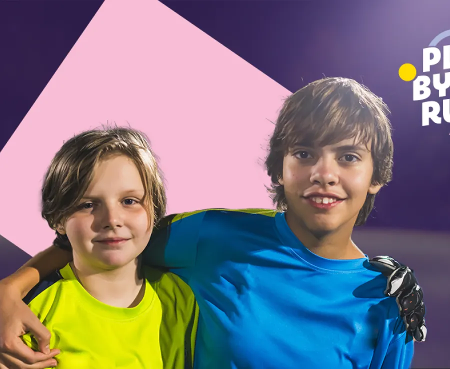 Two young boys smile at the camera